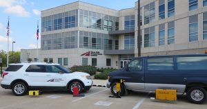 TTI's pavement marking retroreflectivity equipment parked outside the agency headquarters building.