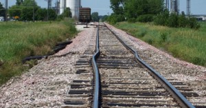 Railway with bent rails due to thermal buckling.
